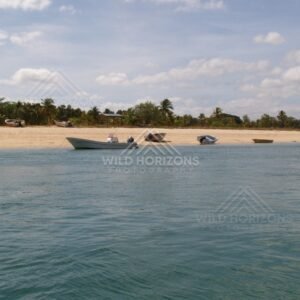 Small boats anchored off a sandy tropical beach. Seisia, Queensland, Australia.