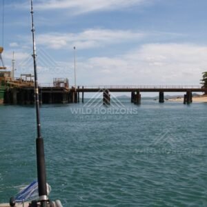 Wharf and ship scene viewed from a small fishing boat. Seisia, Queensland, Australia.