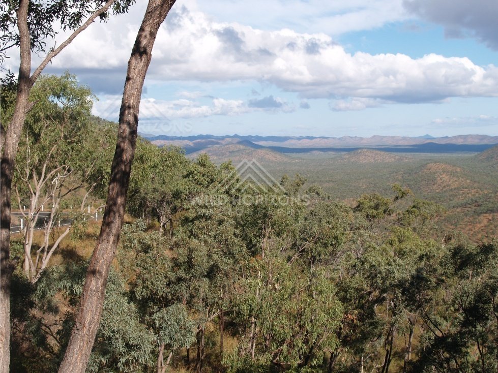 Lookout view over forested hills with eucalypts in the foreground. Queensland, Australia.