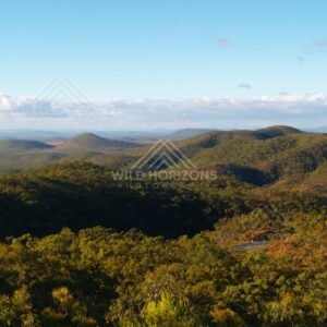 Lookout over green hills and valleys with scattered cloud shadows. Queensland, Australia.