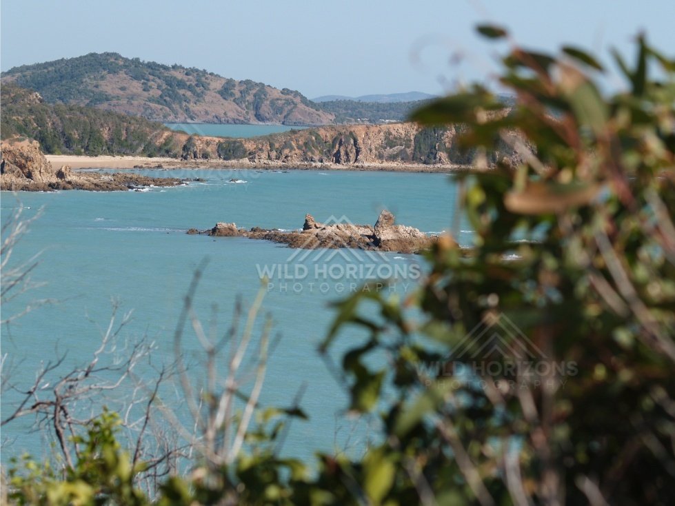 Coastal headland overlooking calm turquoise water. Cape York Region, Australia.