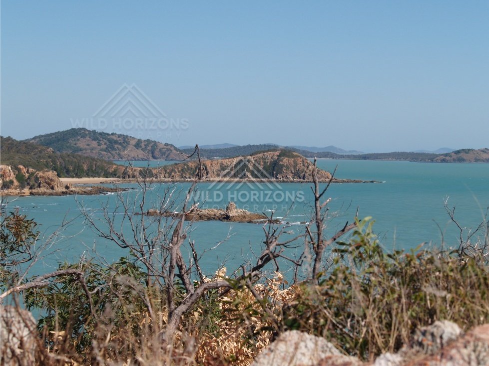 Rocky islets scattered across a sheltered bay. Cape York Region, Australia.