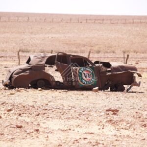 Abandoned rusted car wreck in an arid landscape. Birdsville Region, Australia.