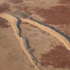 Side-lit rolling sand dunes. Simpson Desert, Australia.