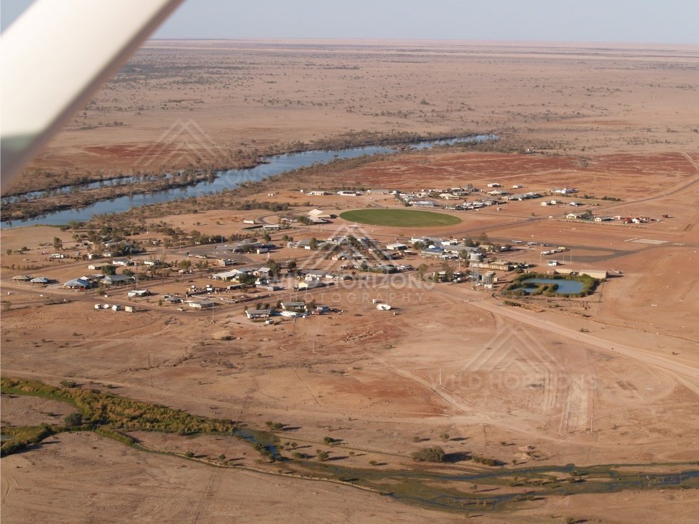 Aerial view of Birdsville township by the river. Birdsville, Australia.