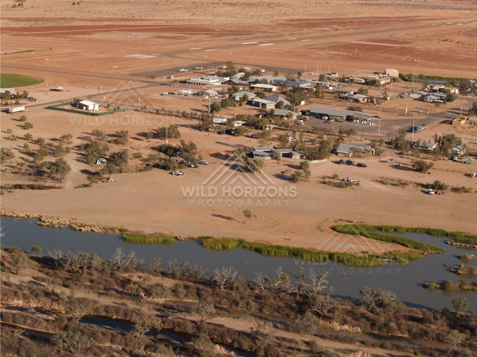 Lower aerial looking across Birdsville near the riverbank. Birdsville, Australia.
