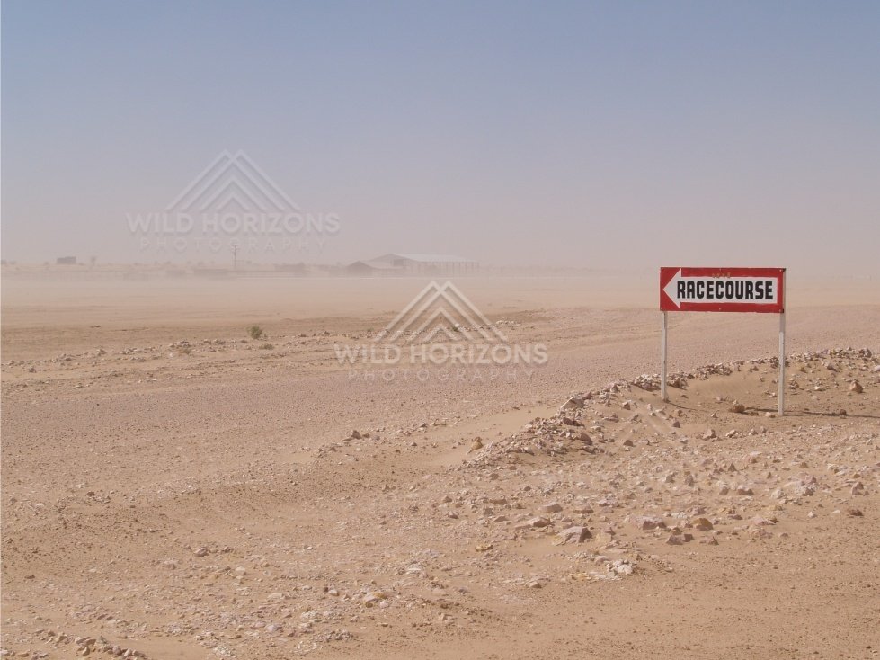 Birdsville Racecourse sign in dust. Birdsville, Australia.