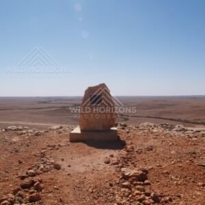 Stone memorial cairn at desert viewpoint. Queensland, Australia.
