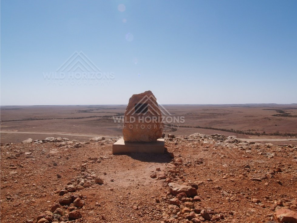 Stone memorial cairn at desert viewpoint. Queensland, Australia.