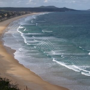 Curving Five Rocks beach from height. Queensland, Australia.
