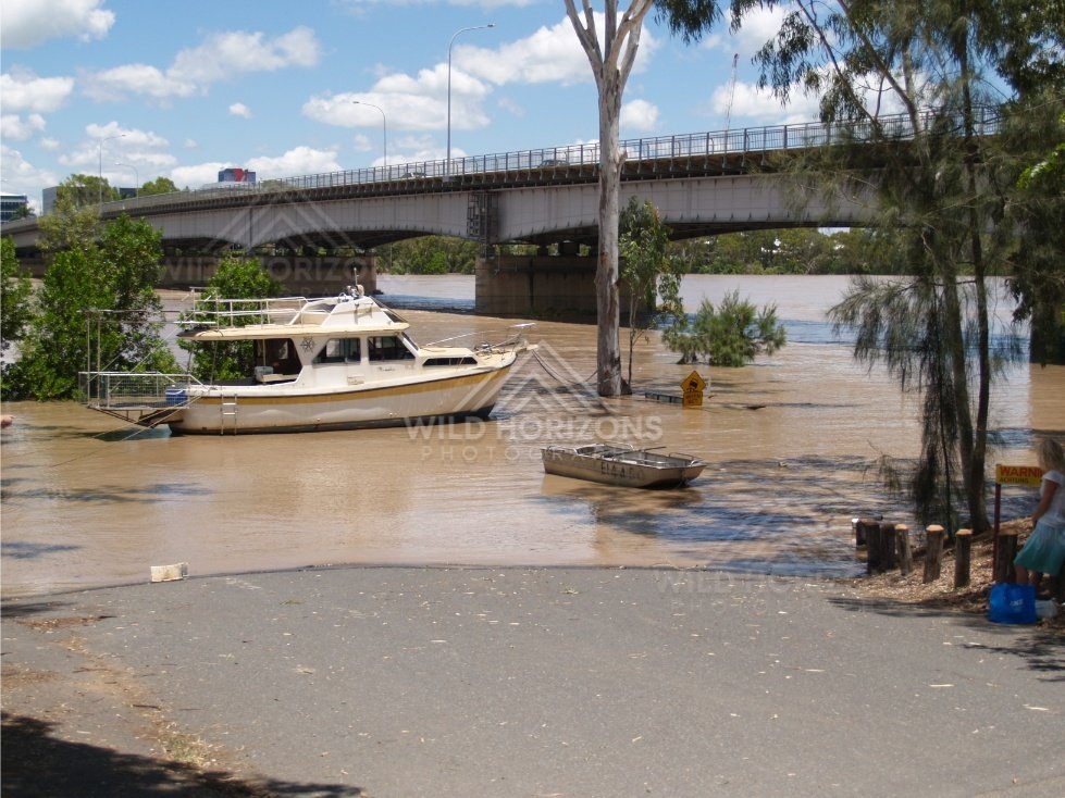 Moored cruiser in floodwater. Rockhampton, Australia.