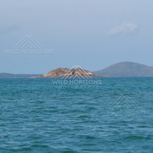 Open sea toward distant low islands. Cape York, Queensland, Australia.