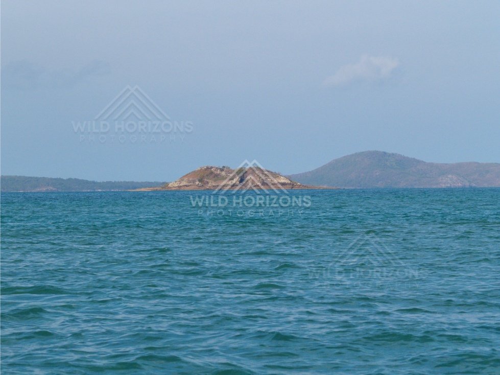 Open sea toward distant low islands. Cape York, Queensland, Australia.