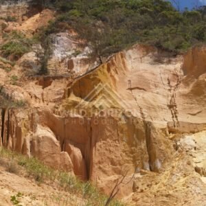 Coloured Sands cliffs with ochre bands. Rainbow Beach, Australia.