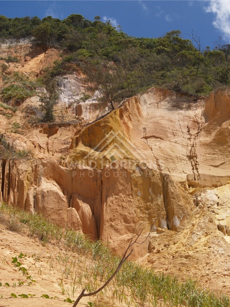 Coloured Sands cliffs with ochre bands. Rainbow Beach, Australia.