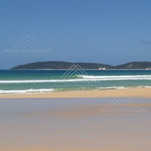 Wet beach looking to Double Island Point. Queensland, Australia.