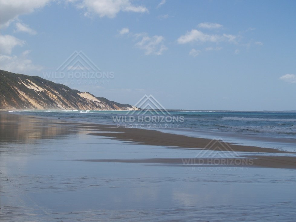 Long view along Rainbow Beach. Queensland, Australia.