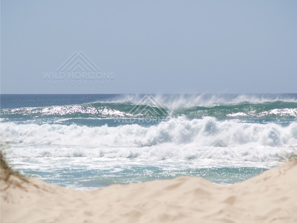 Rolling surf at Rainbow Beach. Queensland, Australia.