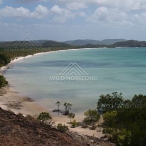 Sheltered Bay with Pale Sand Beach and an Offshore Headland. Cape York, Australia.