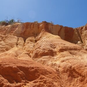 Sunlit sandstone wall at Rainbow Beach. Australia.