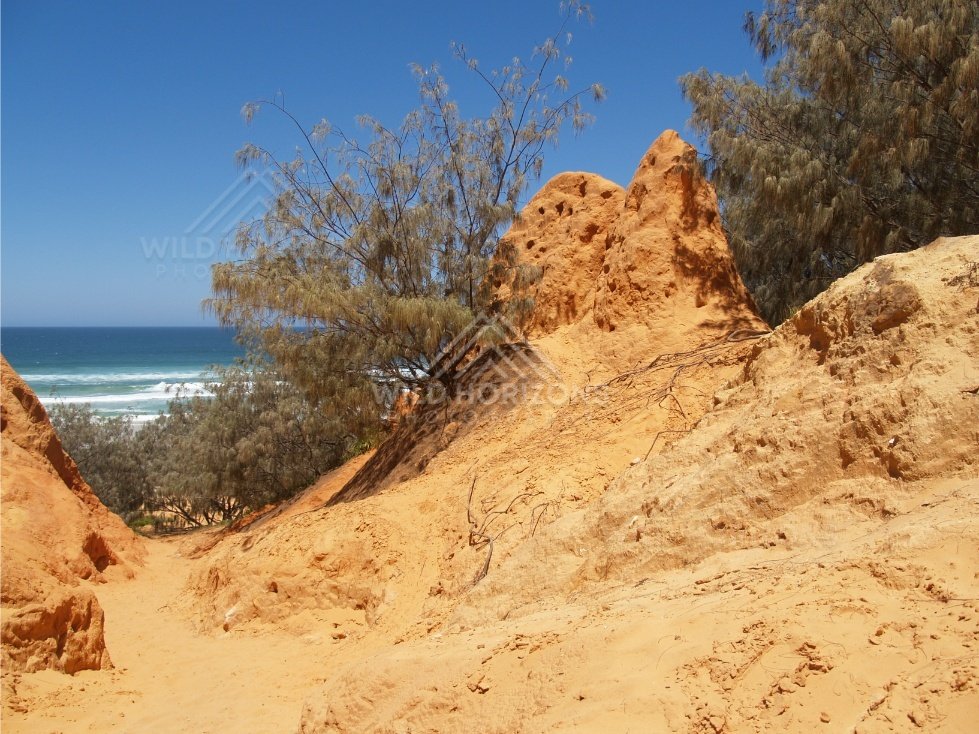 Coastal outlook framed by sandstone. Rainbow Beach, Australia.