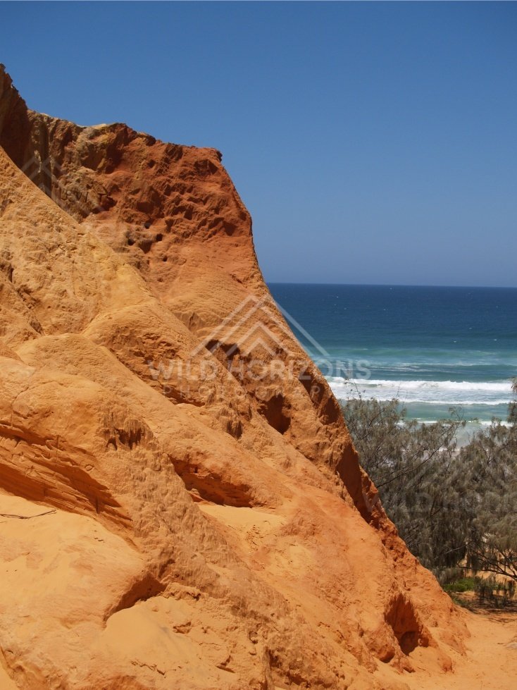 Cliff dropping toward the Pacific. Rainbow Beach, Australia.