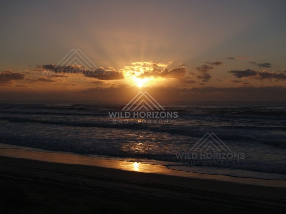 Sunset on Rainbow Beach shoreline. Queensland, Australia.