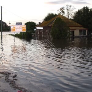 Corner shop isolated by rising floodwater. Bundaberg, Australia.
