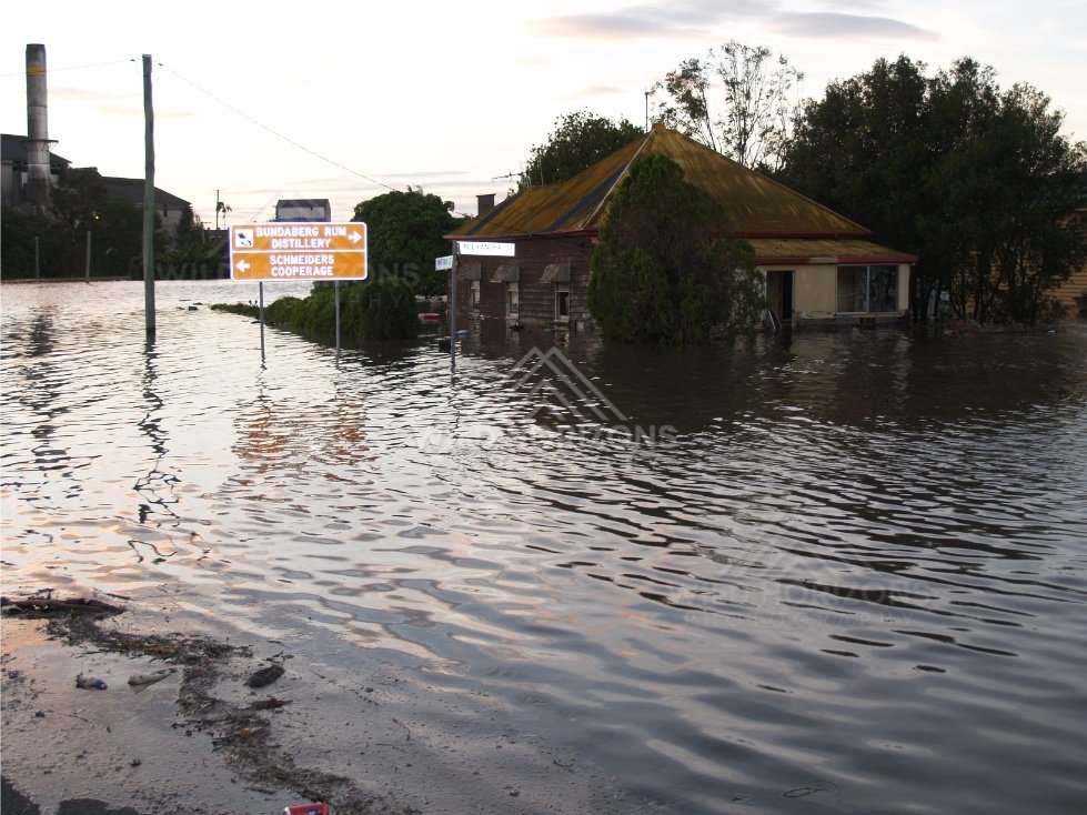 Corner shop isolated by rising floodwater. Bundaberg, Australia.