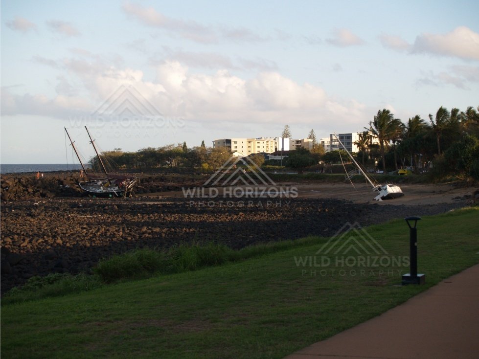 Boats washed ashore after a Bundaberg flood event. Bargara, Australia.