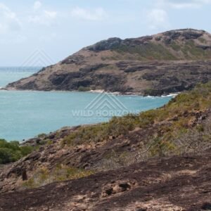 Rocky Coastal Ridge Rising Steeply from the Ocean. Cape York, Australia.