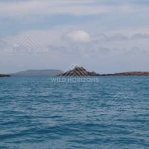Distant island chain across calm sea. Cape York, Queensland, Australia.