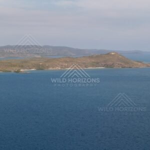 Aerial view across blue sea toward Cape York islands. Thursday Island, Queensland, Australia.