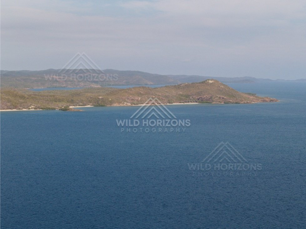 Aerial view across blue sea toward Cape York islands. Thursday Island, Queensland, Australia.