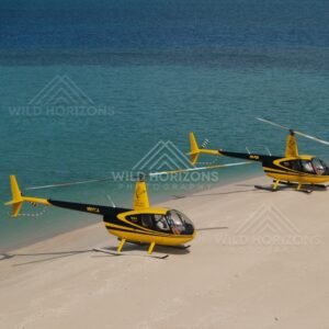 Helicopters on beach beside clear tropical water. Thursday Island, Queensland, Australia.