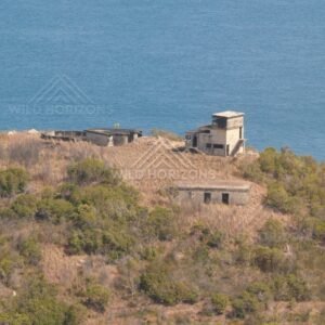 Historic structure on hill overlooking the sea. Possession Island, Queensland, Australia.